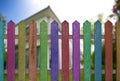 colorful fence with home background
