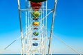 Colorful ferris wheel of the amusement park in the blue sky background Royalty Free Stock Photo