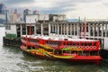 Colorful ferry docked at Hong Kong jetty.