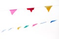 Colorful festive bunting flags against a blue sky and clouds background Royalty Free Stock Photo