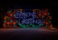 Colorful festive Holiday Christmas Light display of Seasons Greeting spelled out Royalty Free Stock Photo