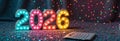 Colorful festive lights displaying 2026 with calendar on glitter background Royalty Free Stock Photo