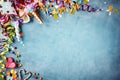 Colorful festive party border on textured blue Royalty Free Stock Photo