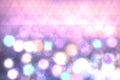 Colorful festive pastel light bokeh abstract texture with blurred circles and triangels.