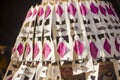 Colorful and festive Penjor Pole decoration. Detail of traditional dyed coconut leaves in Ubud Palace, Bali, Indonesia