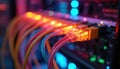 Colorful fiber optic cables connect network devices. Lights blink on server rack for data transmission. Tech background for Royalty Free Stock Photo
