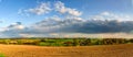 Colorful fields in belgian countryside panoramic view with windmill on horizon Royalty Free Stock Photo