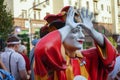 Colorful figure of a clown with arms raised