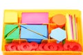 Colorful figures and numbers for children in a box. A tool for developing children`s thinking