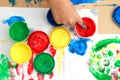 colorful finger paints on a table Royalty Free Stock Photo