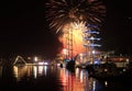 Colorful fireworks above night port