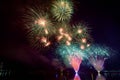 Colorful fireworks against a black night sky.Fireworks for new year. Beautiful colorful fireworks display on the urban lake for Royalty Free Stock Photo