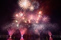 Colorful fireworks against a black night sky.Fireworks for new year. Beautiful colorful fireworks display on the urban lake for Royalty Free Stock Photo