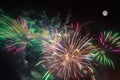 Colorful fireworks against the night sky and the full moon Royalty Free Stock Photo