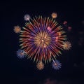 Colorful fireworks burst against a dark night sky, creating a dynamic display of radial Royalty Free Stock Photo