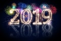 colorful fireworks display and bright sparkler pyrotechnic number 2019 happy new year Royalty Free Stock Photo