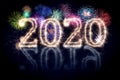 Colorful fireworks display and bright sparkler pyrotechnic number 2020 2019 change happy new year sylvester concept black blue Royalty Free Stock Photo