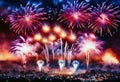 fireworks display over a city at night celebrating new year, anniversary or event Royalty Free Stock Photo