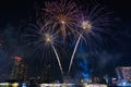 Colorful fireworks explode over the city skyline at night, celebrating the arrival of 2026 with joy, light, and new energy Royalty Free Stock Photo