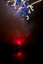 Colorful Fireworks and lake, long exposure, vertical format Royalty Free Stock Photo