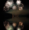 Colorful fireworks with reflection on lake. Royalty Free Stock Photo