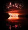 Colorful fireworks with reflection on lake. Royalty Free Stock Photo