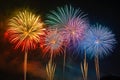 Colorful fireworks soaring over a black background. Can be used as abstract background or wallpaper Royalty Free Stock Photo