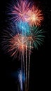 Colorful fireworks soaring over a black background. Can be used as abstract background or wallpaper Royalty Free Stock Photo