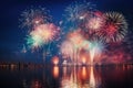 Colorful fireworks of various colors over night sky with reflection on water, Beautiful firework display for celebration with blur Royalty Free Stock Photo