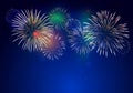 Colorful fireworks vector on dark blue background with sparking bokehs Royalty Free Stock Photo