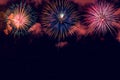 Colorful fireworks with wide dark copy space Royalty Free Stock Photo