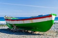 Colorful fishing boat on the beach at the Atlantic Ocean Royalty Free Stock Photo