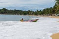 Colorful fishing boat beaching on a sri lankan beach, Arugam bay, Sri lanka