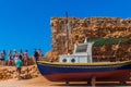 Refurbishment of a wooden fishing boat at the old venetian port in Chania of Crete, Greece Royalty Free Stock Photo