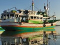 colorful fishing boats anchored in the harbor on Paiton beach Indonesia Royalty Free Stock Photo