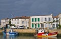 Colorful fishing boats anchored at port.