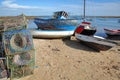 Colorful fishing boats on the beach of Santa Luzia, a fishing harbor located near Tavira, Algarve, with fishing baskets Royalty Free Stock Photo