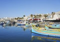 Colorful fishing boats in port of european Marsaxlokk town in Malta