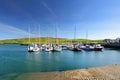 Colorful fishing boats and yachts at the harbor of Dingle town on the West Atlantic coast of Ireland. Small towns and villages on Royalty Free Stock Photo