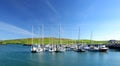 Colorful fishing boats and yachts at the harbor of Dingle town on the West Atlantic coast of Ireland. Towns and villages on famous Royalty Free Stock Photo