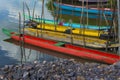 Colorful fishing canoes docked on the river bank Royalty Free Stock Photo