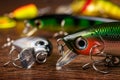 Colorful fishing lures, wobbler, spinner, on wood desk different fishing baits