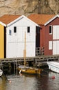 Colorful fishing sheds and wooden boat