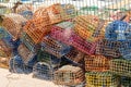 Colorful fishing traps stacked on harbor area with concrete floor Royalty Free Stock Photo