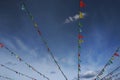 Colorful flags bunting against blue sky. Royalty Free Stock Photo