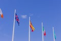 Colorful flags from different countries waving on blue sky background Royalty Free Stock Photo
