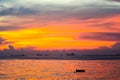 colorful flame cloud sunset boat on sea and sky