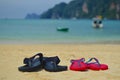 Colorful flip-flops on the beach Royalty Free Stock Photo