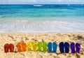 Colorful flip flops on the sandy beach Royalty Free Stock Photo