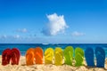 Colorful flip flops on the sandy beach Royalty Free Stock Photo